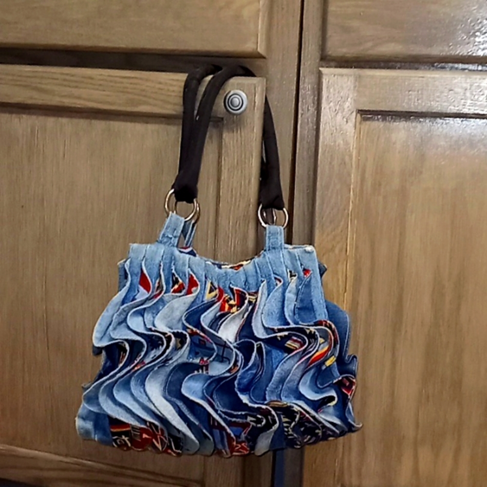 Hand made woven multi color jean purse with studded straps